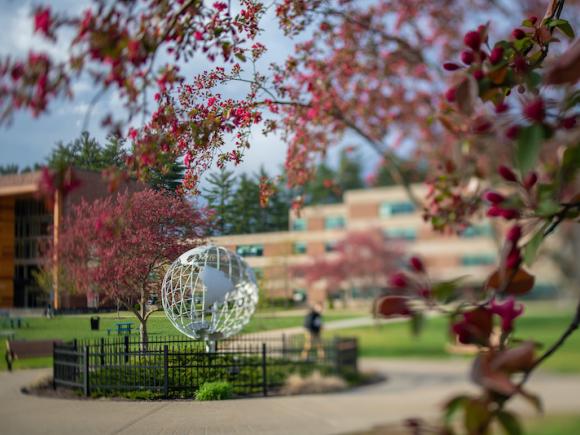 The globe sits on the campus green.