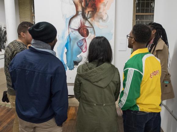 Students looking at an art exhibit in the Arno Maris Gallery.