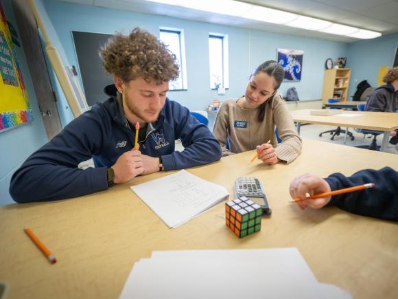 Math Tutoring Center tutor assisting a student with their homework.