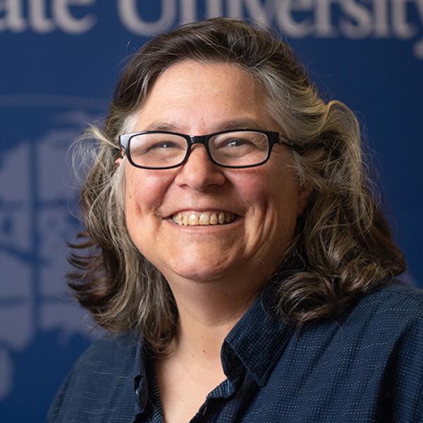 Dr. Elizabeth Stassinos smiles while posing for a photograph.