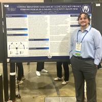 Student presenting research findings at convention.